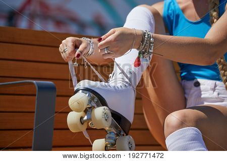 The girl assumes roller skates