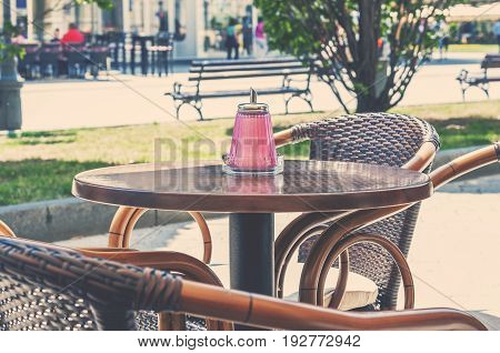 Cafe table outdoor on sunny day in town center