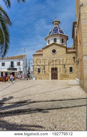ALTEA, SPAIN - JUNE 09, 2017: Central square with tourists and old church in Altea, Spain