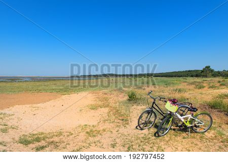 Bikes and Lighthouse La Coubre at the French Atlantic coast in La Palmyre 