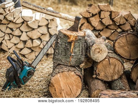 Man chopping wood with a chainsaw close-up