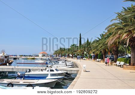 Baska Voda Croatia - August 22 2015: Baska Voda Marina marine harbor with nautical yachts and palms