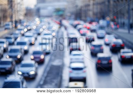 Blurred photo of city roads with moving cars in morning