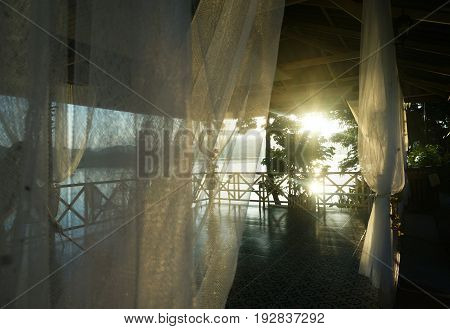 The balcony in the morning sunshine. light shine through the curtain