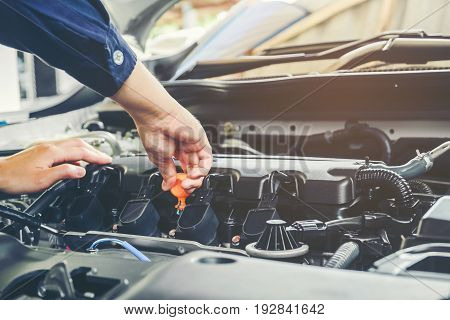 Mechanic Changing Oil Mechanic In Auto Repair Service.