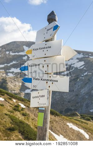Poland Tatra mountains Signpost at Kondracka Przełęcz reamins of snow