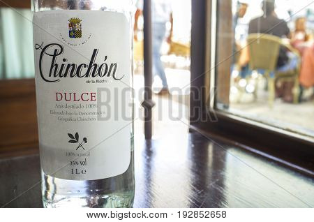 Chinchon Spain - Jun 2017: Anisette bottle served at main square cafe of Chinchon near Madrid