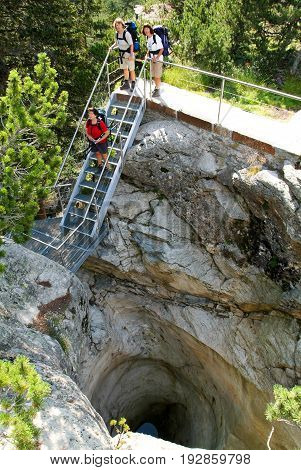 Cavaglia, Switzerland - 21 July 2015: People visiting the Glacier Garden at Cavaglia on the Swiss alps