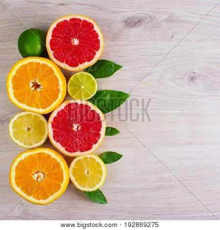 Juicy Citrus Fruits Cut Background Mint Leaf. Oranges, Lemons, Limes, Grapefruit, Mint Leaves On A B