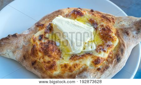 Adjarian Khachapuri With Eggs On The Table