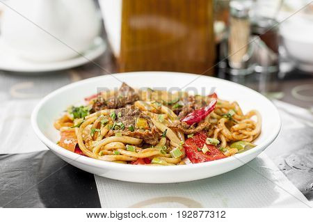 Noodles with mutton and vegetables. Central Asian cuisine Lagman