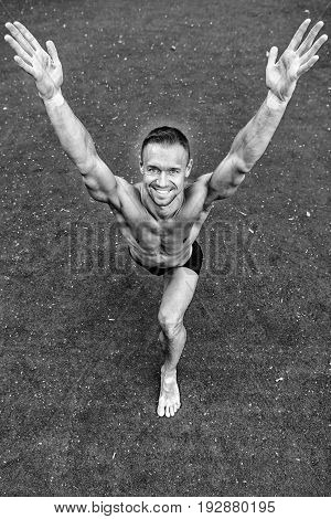 Man Yoga Practice Pose Training Concept athlete doing yoga asana at green background