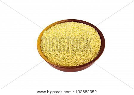Dry raw Millet in rare silver pial isolated on white background