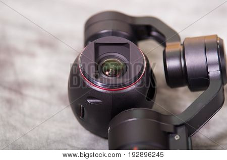 QUITO, ECUADOR- DECEMBER 22, 2017: Close up of Osmo Mobile gimbal, new generation of electronic stabilizer over a gray background.