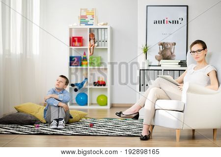 Autistic boy having a session with his therapist
