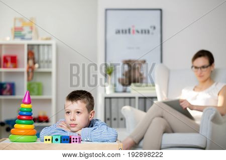 Professional therapist and her autistic patient during a meeting