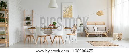 Stylish white studio apartment with dining room and living room