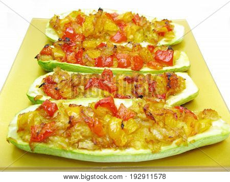 stuffed marrow vegetable and tomato with parsley and fennel on the plate