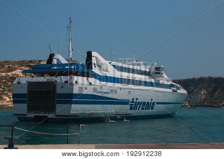 ISOLE TREMITI, ITALY - JUNE 25, 2017: The big Tirrenia ferry on the harbor of Tremiti Islands, San Domino