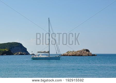 A yacht in the Adriatic sea and the rocky island 2014