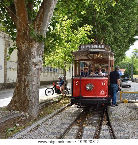 SINTRA PORTUGAL - June 12 2017: Vintage red tram shown on the streets of Sintra. Old trams are one from a lot of tourist attraction in Sintra
