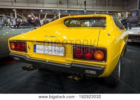MAASTRICHT NETHERLANDS - JANUARY 14 2016: Sports car Ferrari 308 GT4 Dino 1977. Rear view. International Exhibition InterClassics & Topmobiel 2016
