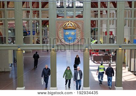 GOTHENBURG SWEDEN - MAY 2017: Interior of Gothenburg Central Train Station with Coat of Arm in a glass wall.