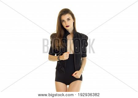 Portrait of a beautiful slim girl in black dress and erotic dark lipstick is isolated on a white background