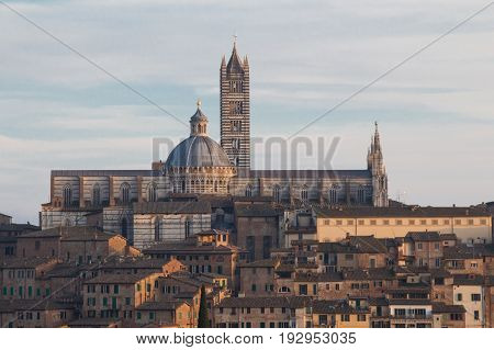 Italy Siena - December 26 2016: the view of Duomo di Siena or Metropolitan Cathedral of Santa Maria Assunta from north on December 26 2016 in Siena Tuscany Italy.