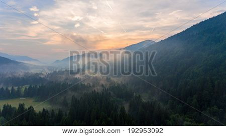 Aerial view of sunrise over a valley. Natural park Zelenci, Slovenia.