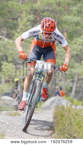 STOCKHOLM SWEDEN - JUNE 11 2017: Mountain bike cyclist in the forest at Lida Loop Mountain bike Race. June 11 2017 in Stockholm Sweden