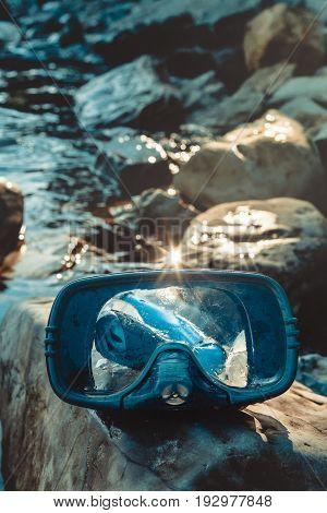 Blue Mask For Diving And Snorkel Lie On The Beach, On The Rocks, Clodeup. Tourism And Travel Concept