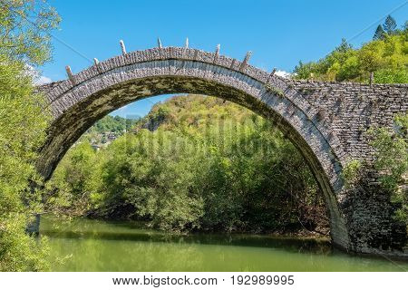 Arches stone bridge of Kalogeriko (or Plakida) on the river of Voidomatis. Central Zagoria Epirus Greece