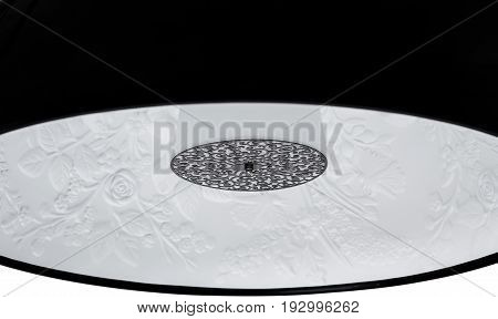 A Close Up Partial View of a Black Floor Lamp. Black part of lamp isolated on white