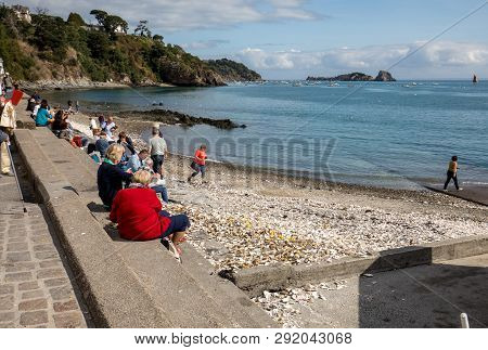 Cancale, France - September 15, 2018: People Eating Oysters Bought On The Seafront At Cancale, Britt