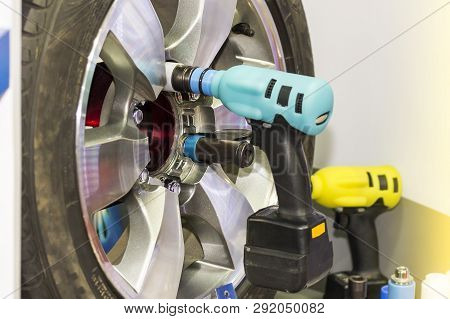 Close Up Electric Wrench Tool For Assembly Or Uninstall Car Wheel At Garage Or Workshop