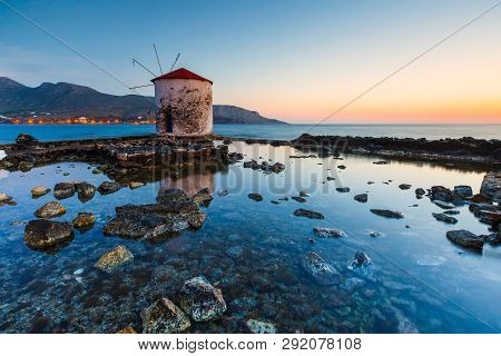 Sunrise Landscape With A Windmill In Agia Marina Village On Leros Island In Greece.