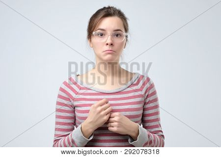 Speechless Woman With Arms Down For Disillusion