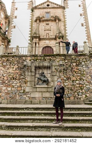Caceres, Caceres, Spain - February 10, 2019: A Young Woman Takes A Picture With A Selfie Stick In Th