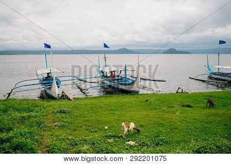 Phishing Boat On A Shore Of Beautiful Lake Taal, Philippines. Landscape Of Luzon Island With Volcano