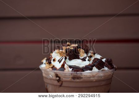 Iced Chocolate Drink Decorated With Whipped Cream And Brownies In A Glass