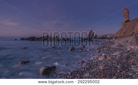 Nerja, Malaga, Andalusi, Spain - February 10, 2019: Molino Beach, Small Stone Beach With Three Large