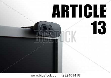 A Modern Web Camera On Monitor And Article 13 Inscription