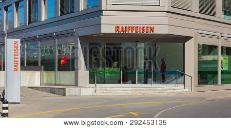 Chur, Switzerland - September 27, 2018: An Office Of The Raiffeisen Bank In The City Of Chur, People