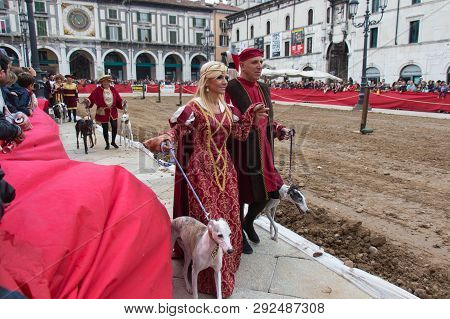 Italy, Brescia - October 01 2017: The View Of The People In Medieval Costumes With Dogs At Tradition