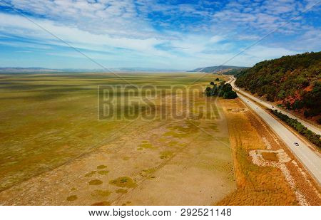 Empty Lake George Nestled Between Farmland And Federal Highway In Australia. Lake George Is An Endor