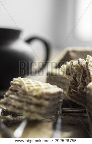 Sweet Russian Artek Waffles On Wooden Background, With A Pot Of Milk. Traditional Sweets And Dessert