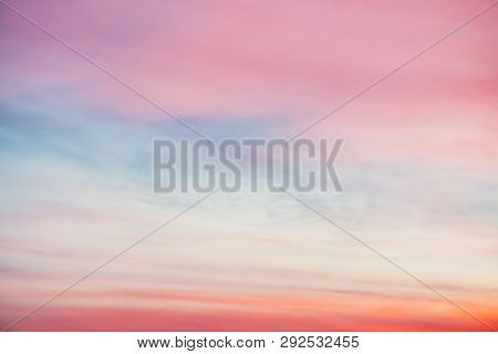 Sunset Sky With Pink Orange Light Clouds. Colorful Smooth Blue Sky Gradient. Natural Background Of S