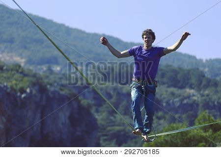 Man Balancing On The Rope Concept Of Risk Taking And Challenge.