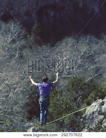 Man Balancing On The Rope Concept Of Risk Taking And Challenge.